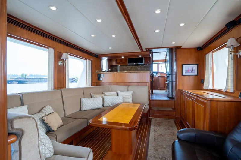 Slide: The Image of Luxurious 2009 Outer Reef Yachts motor yacht interior with elegant wood finishes and comfortable seating. - 5