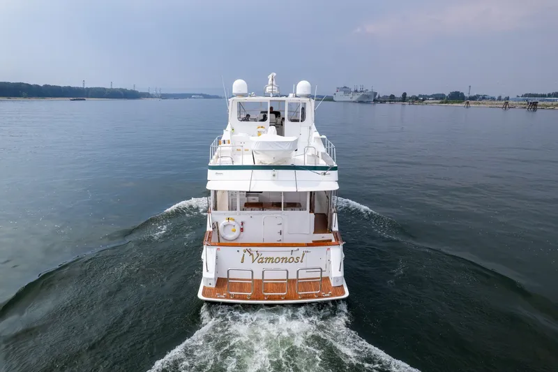Slide: The Image of 2009 Outer Reef Yachts Motor Yacht cruising on calm waters, rear view. - 49