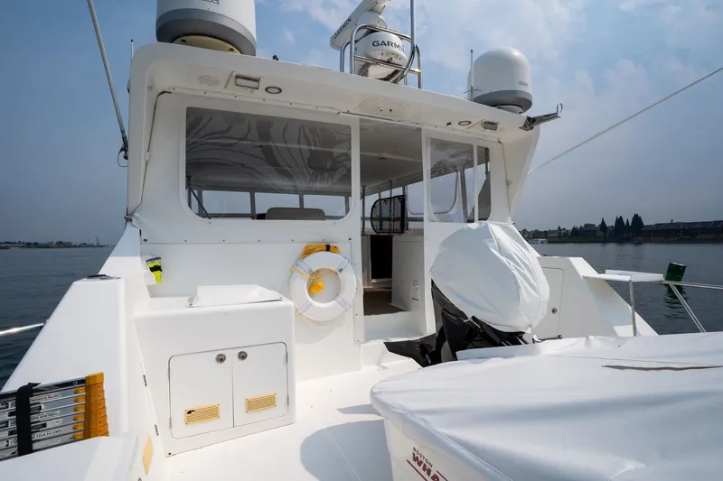 Slide: The Image of 2009 Outer Reef Yachts Motor Yacht deck with navigation equipment and safety gear. - 31