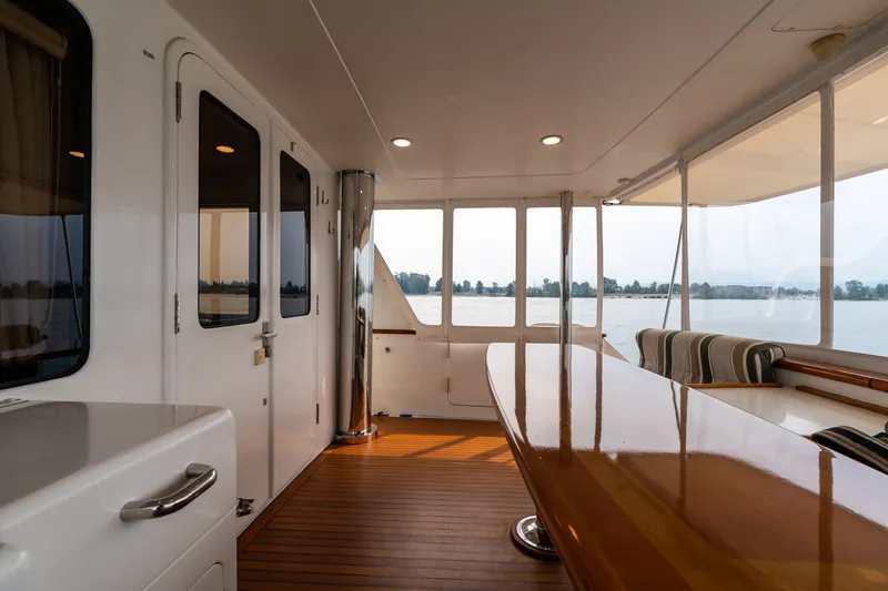 Slide: The Image of Luxurious 2009 Outer Reef Yachts motor yacht interior with polished wood and scenic water views. - 44