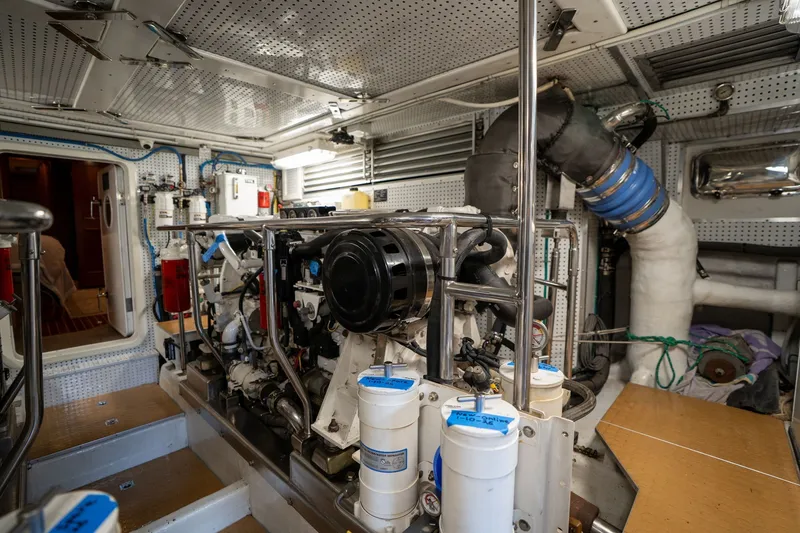 Slide: The Image of Engine room of a 2009 Outer Reef Yachts Motor Yacht, showcasing mechanical components. - 64