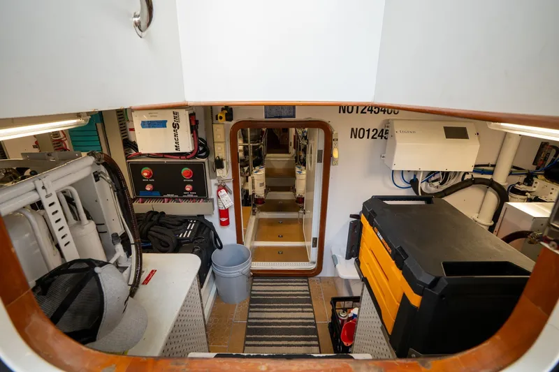Slide: The Image of Engine room of 2009 Outer Reef Yachts Motor Yacht, featuring equipment and storage. - 62