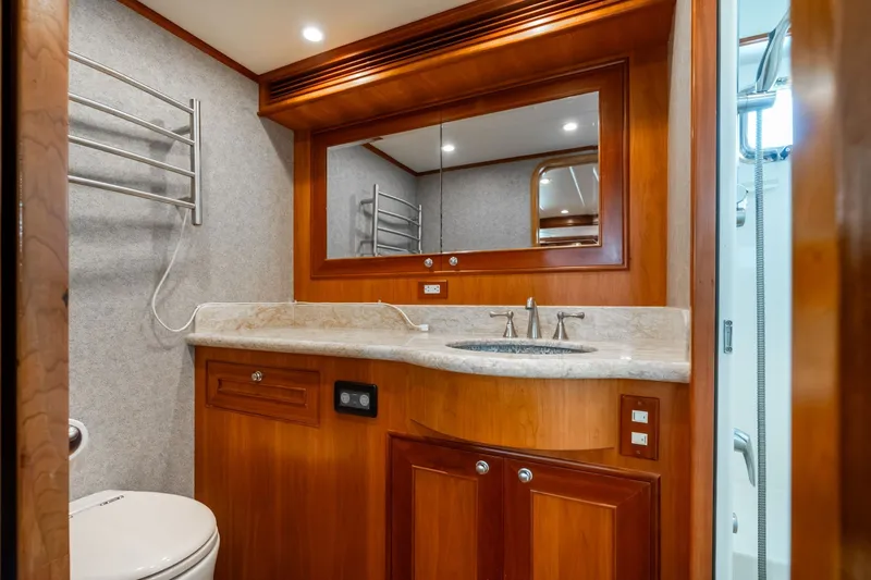 Slide: The Image of Luxurious 2009 Outer Reef Yachts motor yacht bathroom with wood cabinetry and modern fixtures. - 20