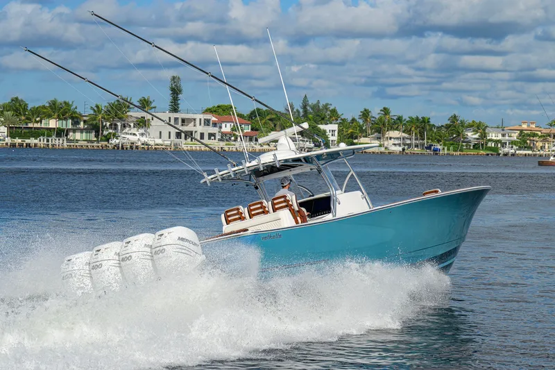 Slide: The Image of 2020 Valhalla V-41 boat cruising on water with powerful engines and fishing rods. - 16