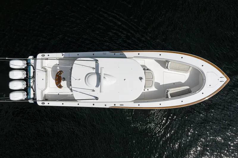 Slide: The Image of Aerial view of 2020 Valhalla V-41 boat with four engines on dark water. - 9