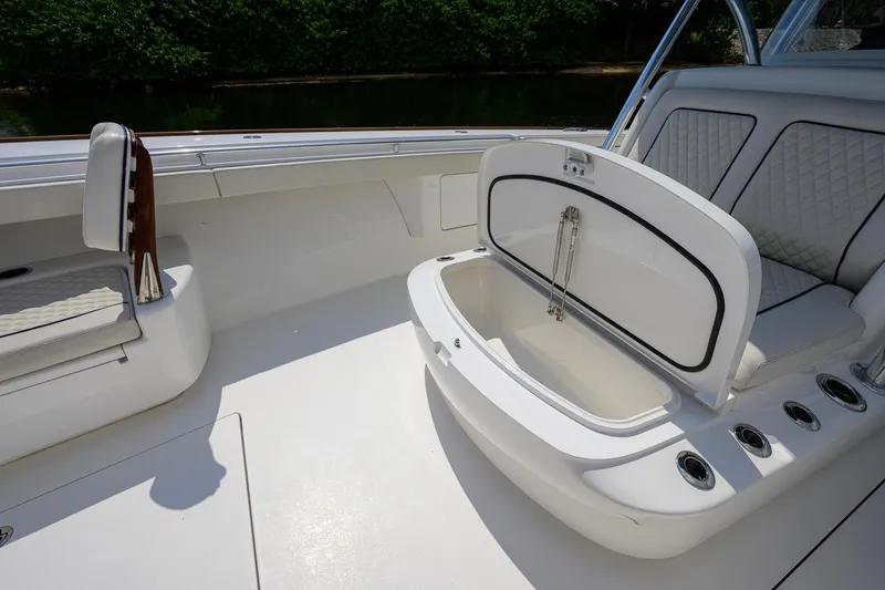Slide: The Image of 2020 Valhalla Boatworks V-41 interior with open storage compartment and cushioned seating. - 39