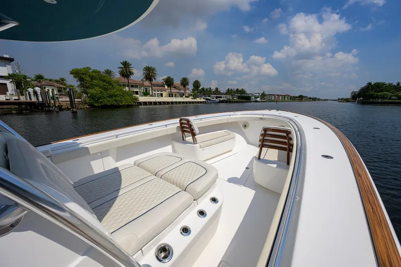 Slide: The Image of 2020 Valhalla Boatworks V-41 on a scenic waterway, featuring luxurious seating and elegant design. - 44