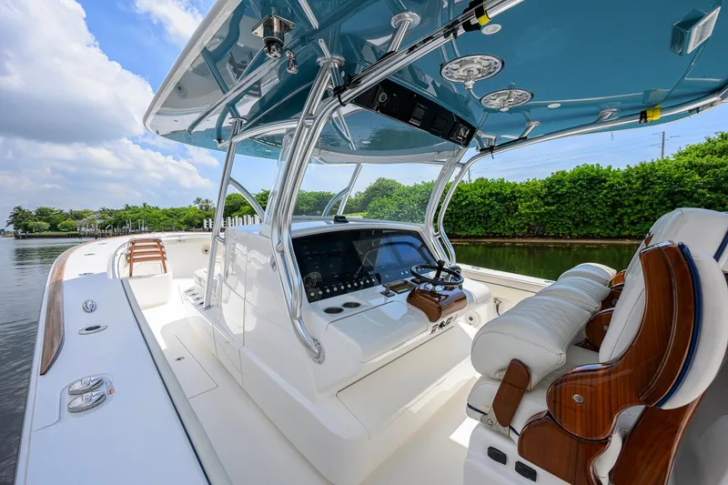 Slide: The Image of 2020 Valhalla Boatworks V-41 interior with helm, luxurious seating, and sleek design. - 16