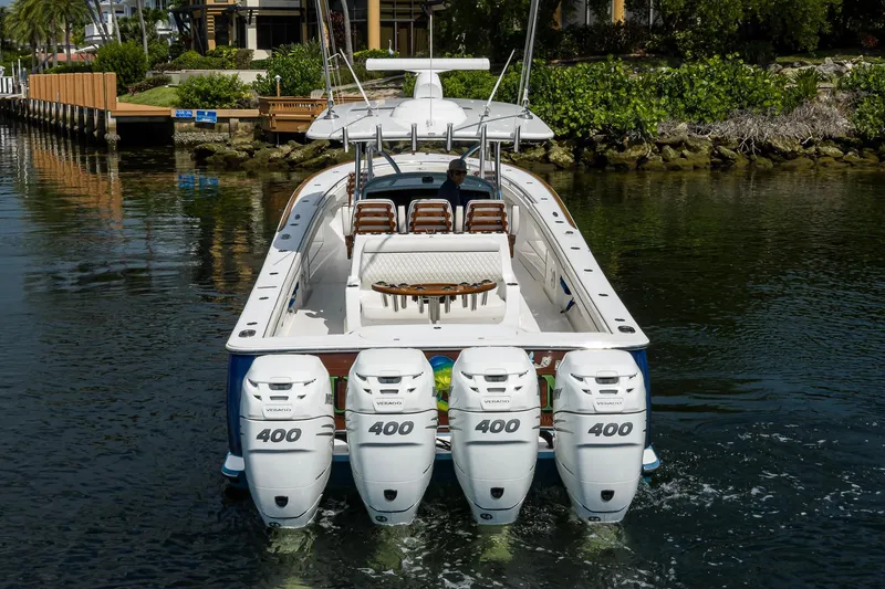 Slide: The Image of 2020 Valhalla Boatworks V-41 with four powerful outboard engines cruising on a calm waterway. - 12