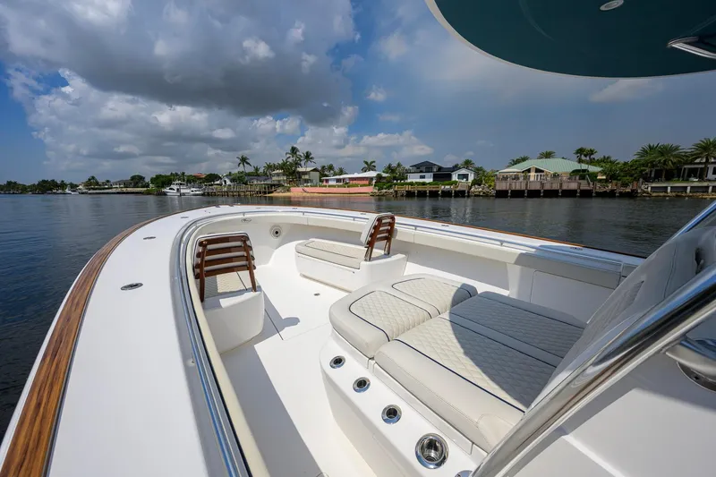 Slide: The Image of 2020 Valhalla Boatworks V-41 on calm water, featuring luxurious seating and sleek design. - 29