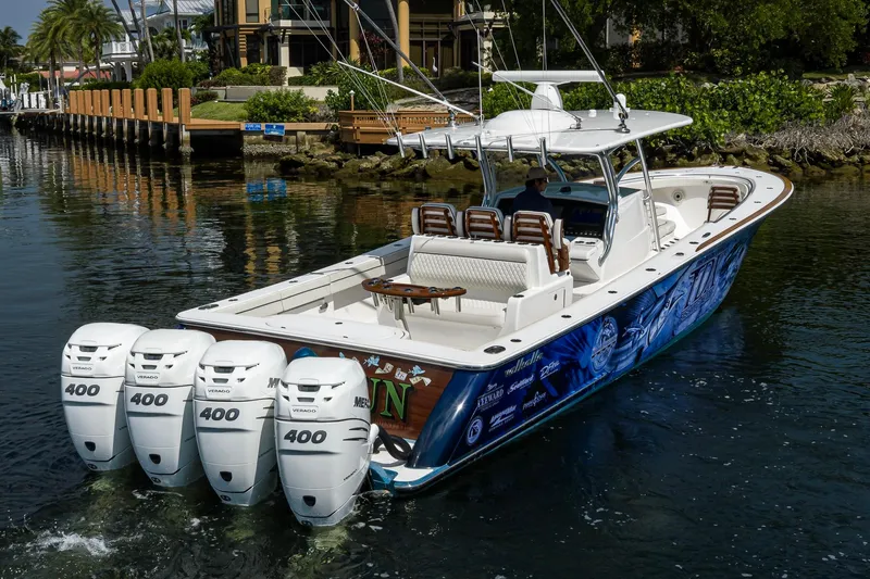 Slide: The Image of 2020 Valhalla Boatworks V-41 with quad 400 engines cruising in a scenic waterway. - 13