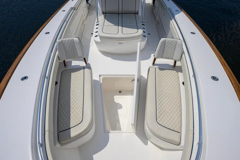 Slide: The Image of 2020 Valhalla Boatworks V-41 interior with cushioned seating and storage compartment. - 43