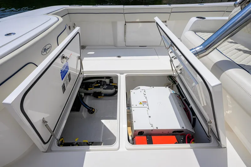 Slide: The Image of 2020 Valhalla Boatworks V-41 storage compartments open, showcasing interior equipment and wiring. - 63