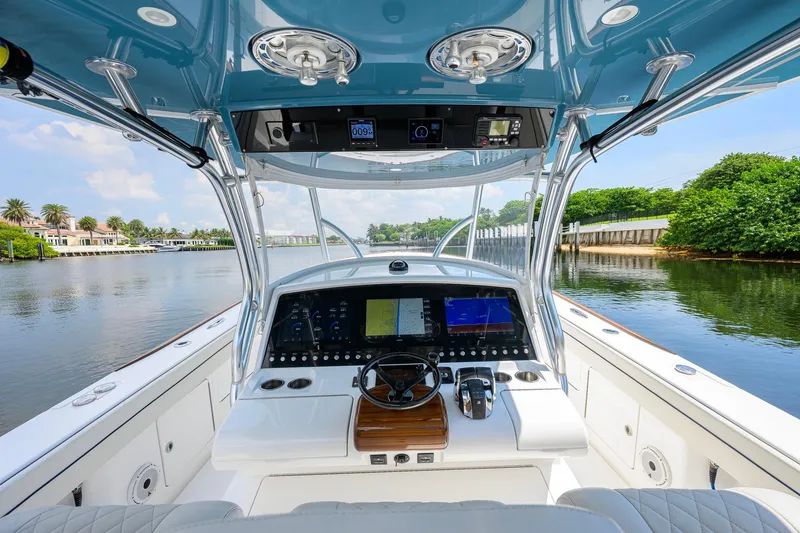 Slide: The Image of 2020 Valhalla Boatworks V-41 helm with advanced navigation system on a scenic waterway. - 18