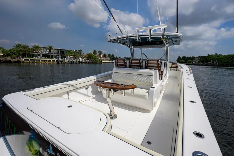 Slide: The Image of 2020 Valhalla Boatworks V-41 on calm water, showcasing spacious deck and seating. - 52