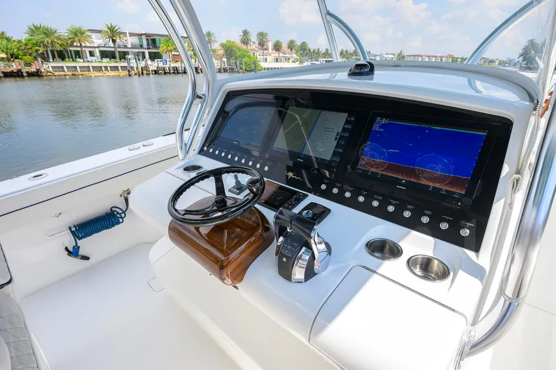 Slide: The Image of 2020 Valhalla Boatworks V-41 helm with advanced navigation displays and controls. - 20