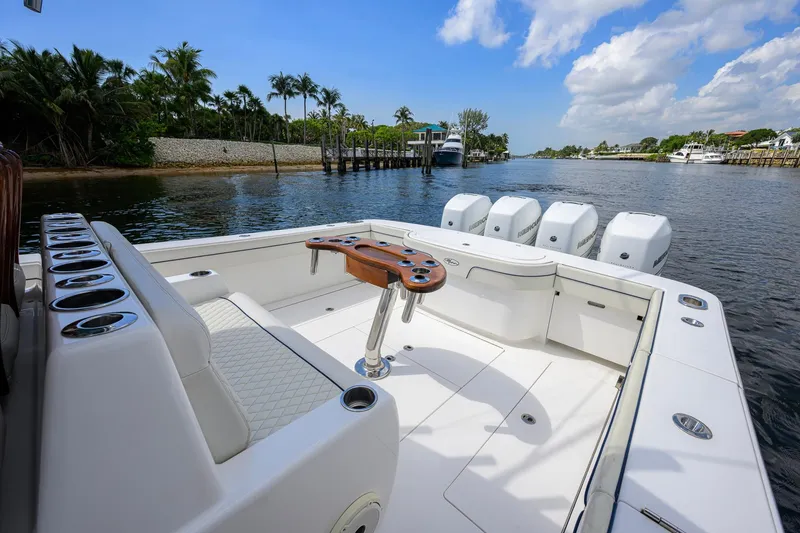 Slide: The Image of 2020 Valhalla Boatworks V-41 with spacious deck and multiple outboard engines on a scenic waterway. - 46
