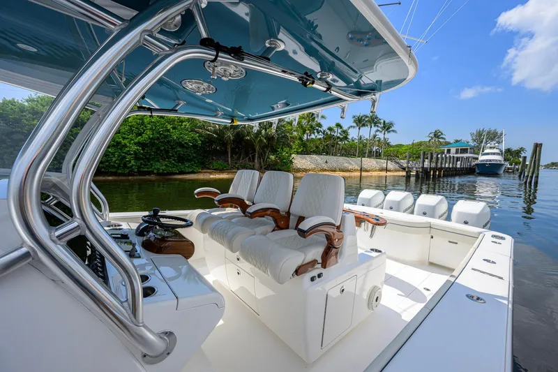 Slide: The Image of 2020 Valhalla Boatworks V-41 with luxurious seating and sleek design docked by lush greenery. - 26