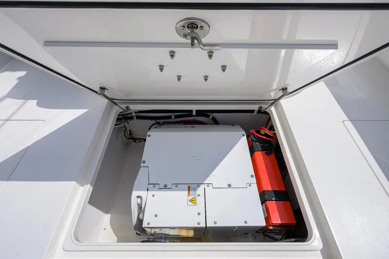 Slide: The Image of 2020 Valhalla Boatworks V-41 electrical compartment with battery and wiring. - 62