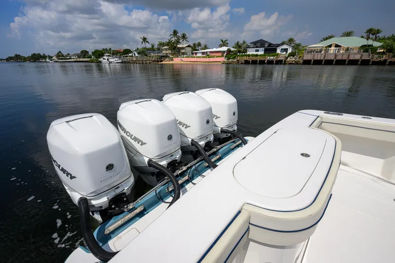 Slide: The Image of 2020 Valhalla Boatworks V-41 with four Mercury outboard engines on a calm waterfront. - 75