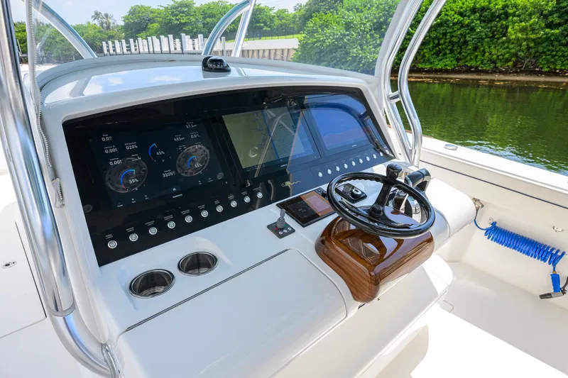Slide: The Image of 2020 Valhalla Boatworks V-41 helm with advanced navigation displays and steering wheel. - 17