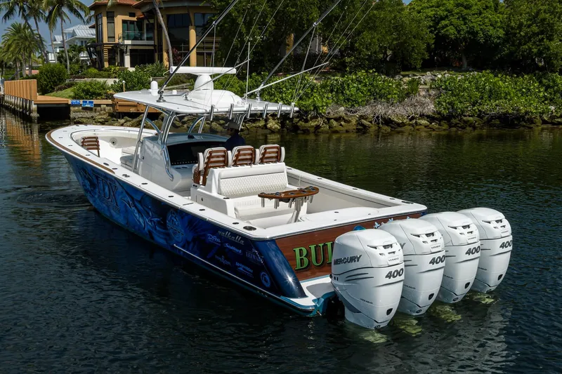 Slide: The Image of 2020 Valhalla Boatworks V-41 with four Mercury 400 engines on a scenic waterway. - 11
