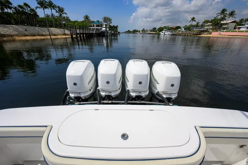 Slide: The Image of 2020 Valhalla Boatworks V-41 with four Mercury outboard engines on a calm waterway. - 73