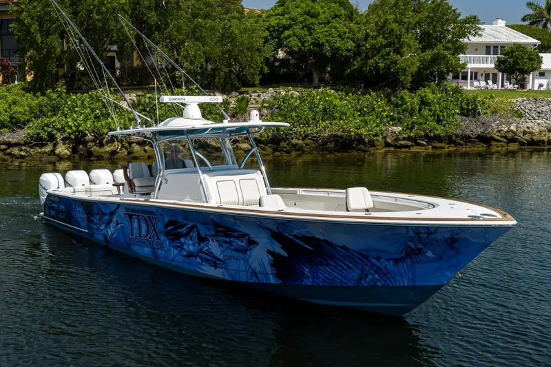 Slide: The Image of 2020 Valhalla Boatworks V-41 with custom graphics, cruising on a calm waterway. - 5