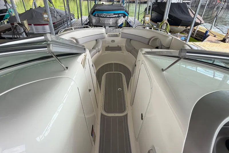 Slide: The Image of Interior view of a 2010 Bryant 255 boat docked in a marina. - 26