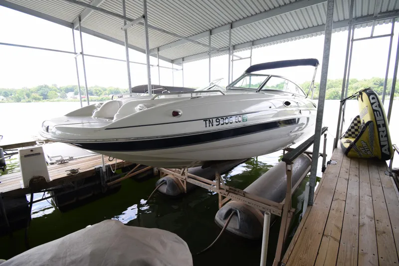 Slide: The Image of A 2010 Bryant 255 boat is in a covered dock. - 4