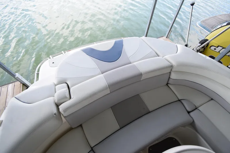 Slide: The Image of The image shows the stern of a boat with cushioned seating and a view of the water. - 44