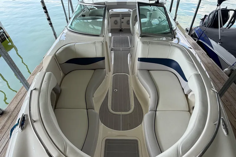 Slide: The Image of Interior view of a 2010 Bryant 255 boat with spacious seating and sleek design. - 7