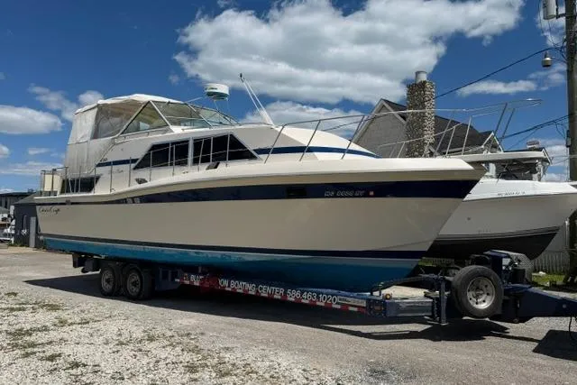 Slide: The Image of 1980 Chris-Craft 381 Catalina boat on trailer under blue sky. - 1