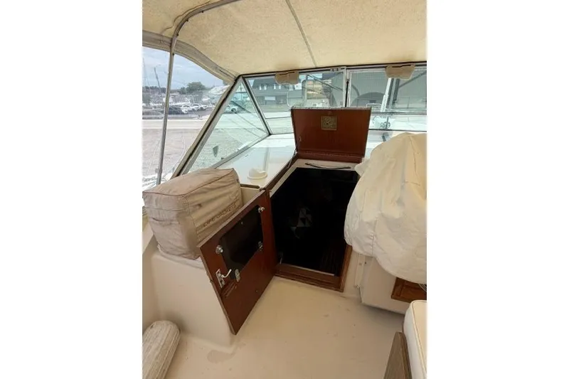 Slide: The Image of 1980 Chris-Craft 381 Catalina cabin entrance with open hatch and cushioned seating. - 15