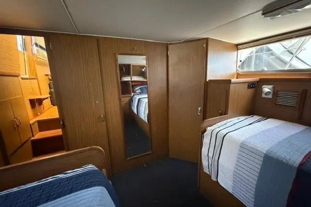 Slide: The Image of Interior of 1980 Chris-Craft 381 Catalina yacht with cozy cabin and wooden furnishings. - 27