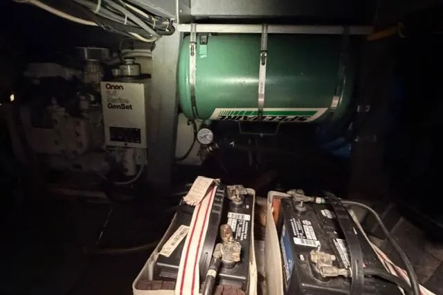 Slide: The Image of Engine room of 1980 Chris-Craft 381 Catalina with batteries and generator. - 33