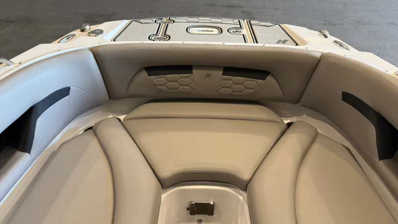 Slide: The Image of The image shows the bow area of a 2022 Four Winns HD5 boat with cushioned seating. - 33