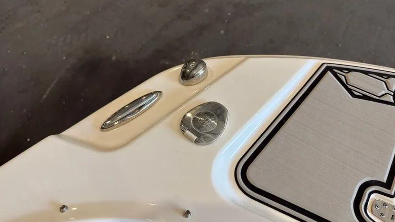 Slide: The Image of Close-up of a 2022 Four Winns HD5 boat section with stainless steel fittings. - 37