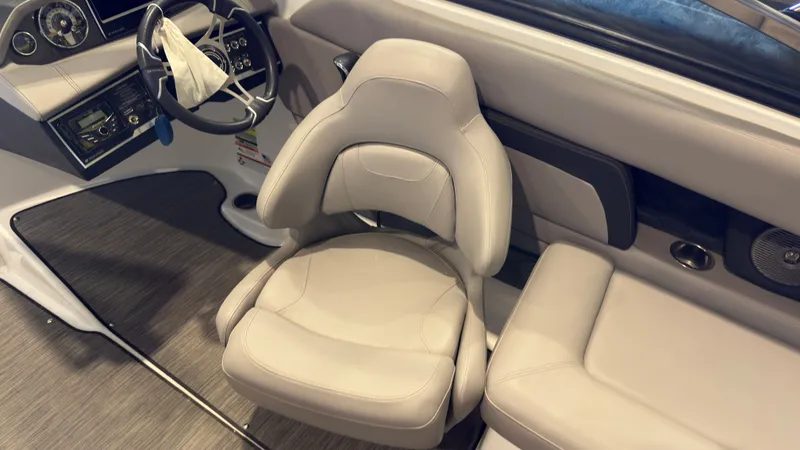 Slide: The Image of The image shows the interior of a 2022 Four Winns HD5 boat with a beige seat. - 18