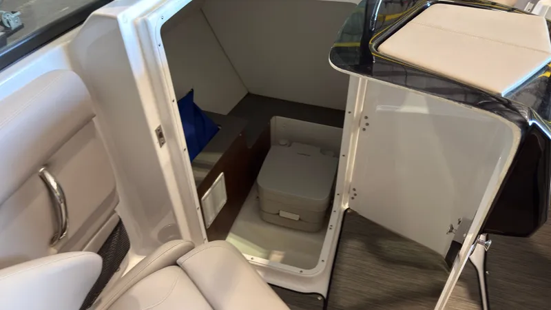 Slide: The Image of The image shows the interior of a 2022 Four Winns HD5 boat with seating and storage area. - 16
