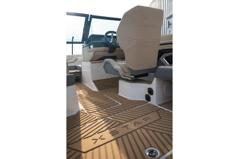 Slide: The Image of 2026 MasterCraft XStar 23 interior with sleek seating and modern design. - 17