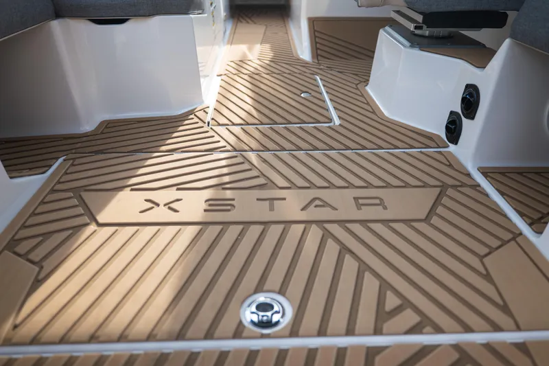 Slide: The Image of 2026 MasterCraft XStar 23 boat interior with stylish, textured flooring design. - 18