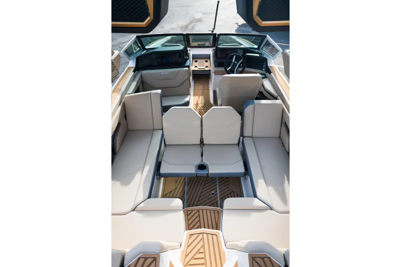 Slide: The Image of 2026 MasterCraft XStar 23 boat interior with luxurious seating and modern design. - 19