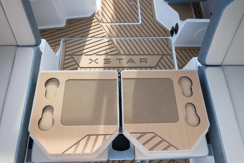 Slide: The Image of 2026 MasterCraft XStar 23 interior with custom flooring and seating. - 20