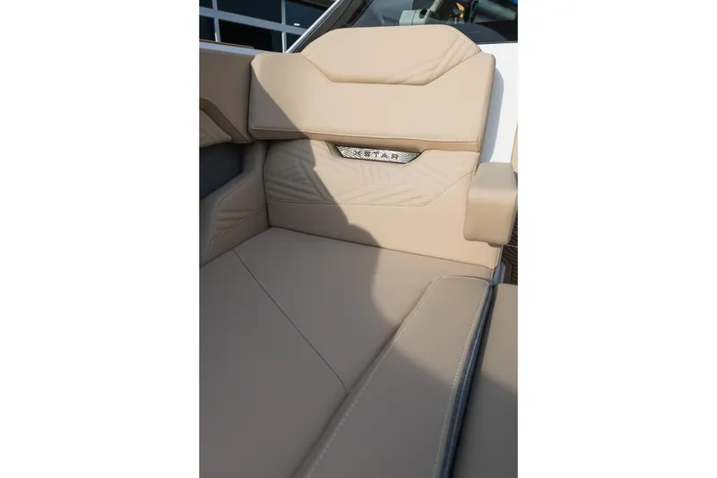 Slide: The Image of Luxurious beige seating in the 2026 MasterCraft XStar 23 boat interior. - 26