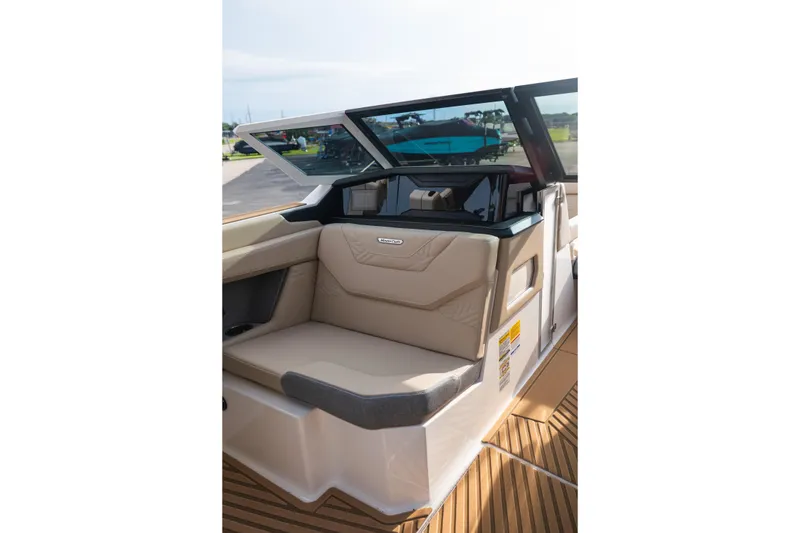 Slide: The Image of 2026 MasterCraft XStar 23 boat interior with beige seating and sleek design. - 31