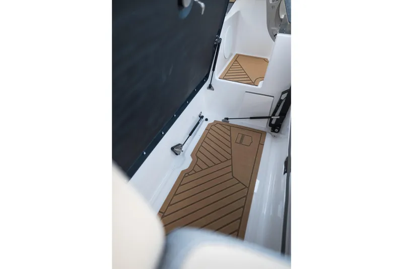 Slide: The Image of Interior view of 2026 MasterCraft XStar 23 boat with stylish flooring design. - 32