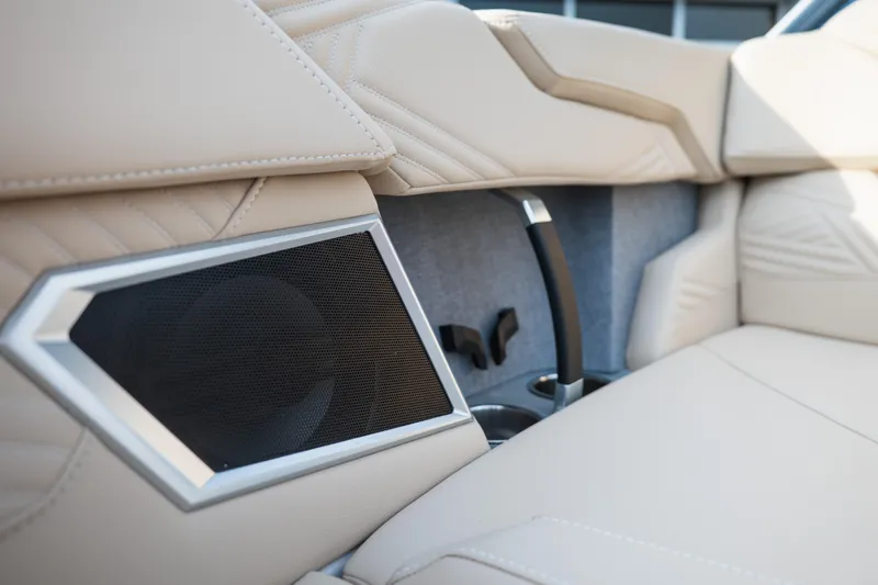 Slide: The Image of Luxury seating and speaker detail in 2026 MasterCraft XStar 23 boat interior. - 34