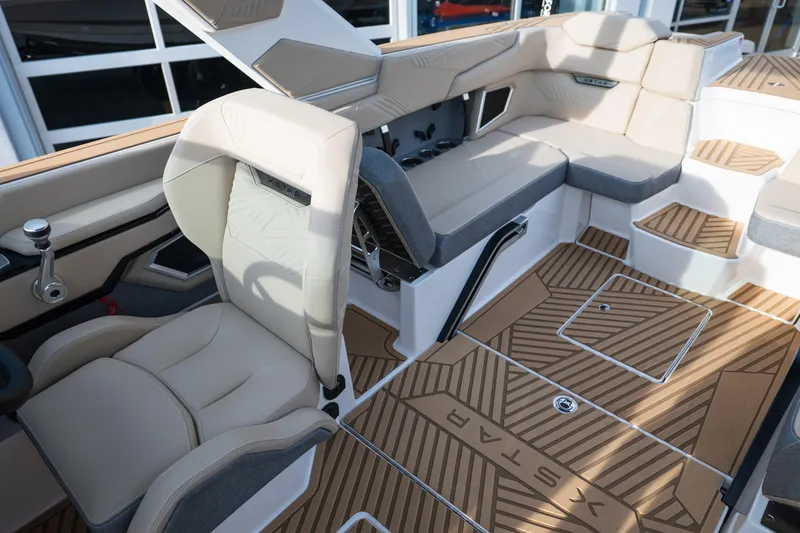 Slide: The Image of 2026 MasterCraft XStar 23 interior with luxurious seating and stylish flooring design. - 36