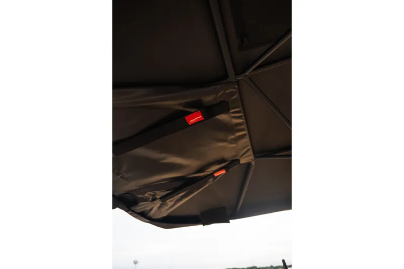Slide: The Image of Close-up of the 2026 MasterCraft XStar 23 boat canopy with visible stitching and straps. - 37